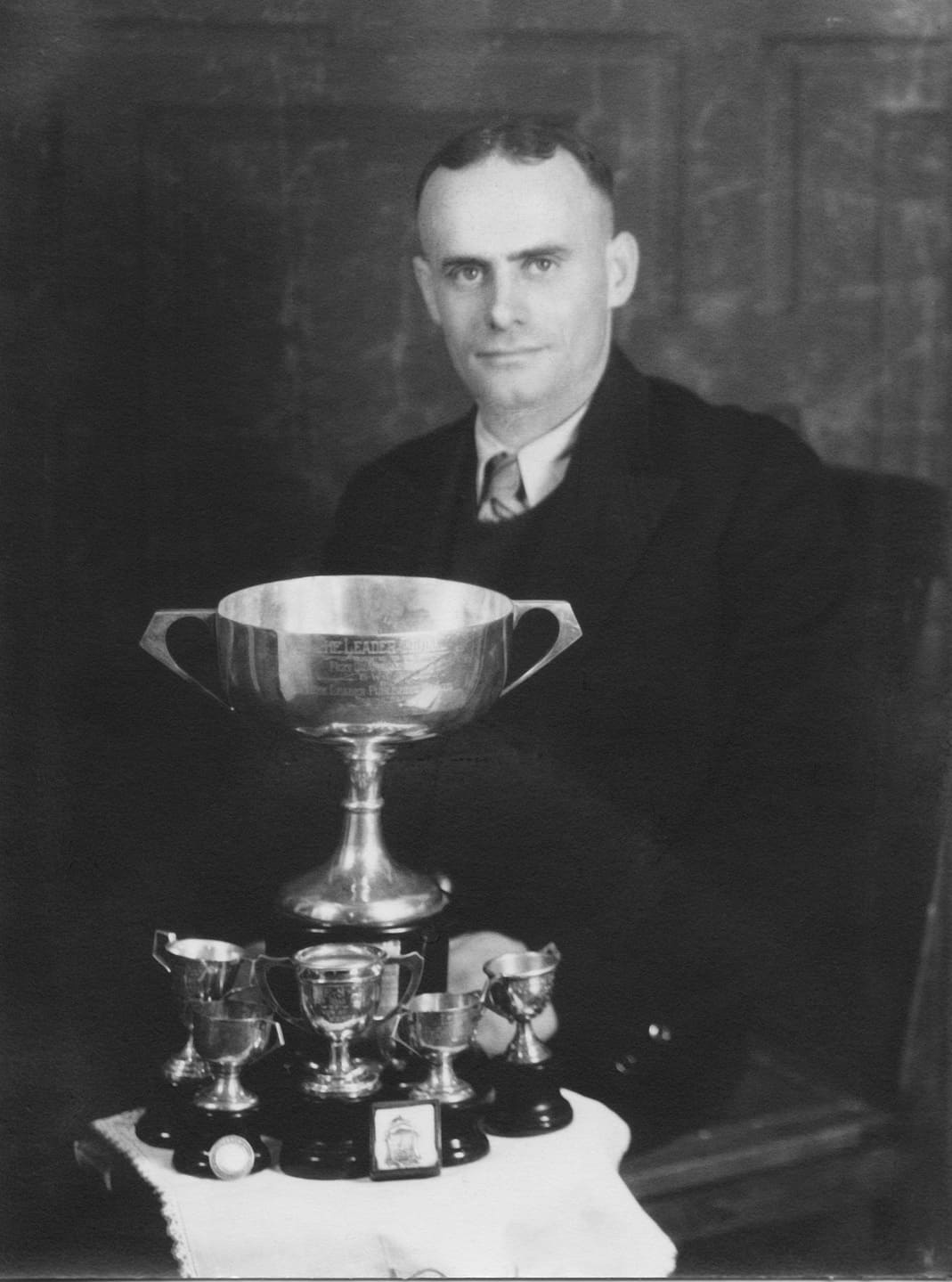 John Wendell with trophies - honey is the ideal energy source for athletes
