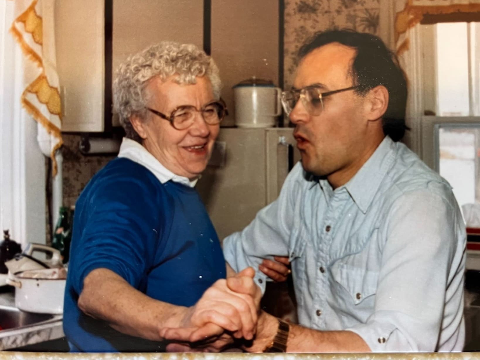 "Granmma" Wendell being danced in the kitchen by her son, Miles