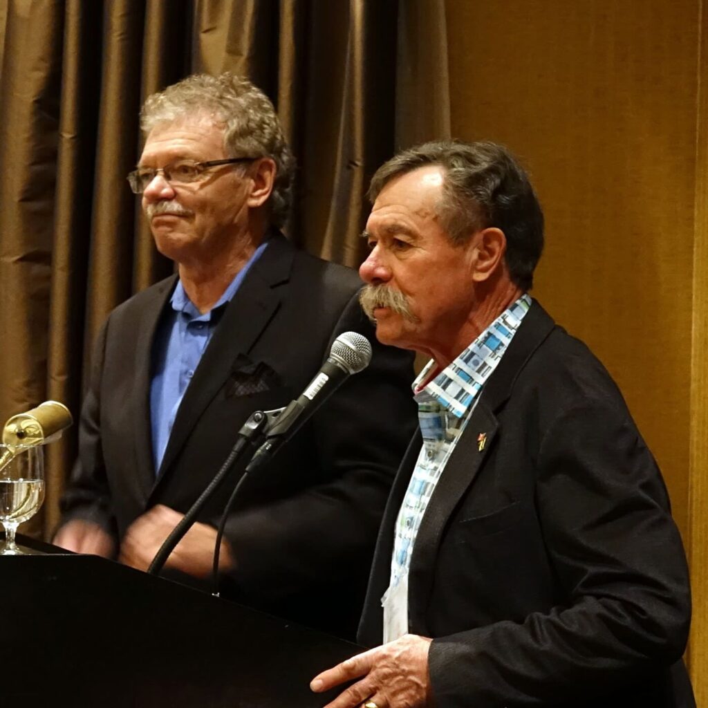 Tim Wendell (right), Founder & Owner, Wendell Estate Honey, speaking at a beekeeping conference.
