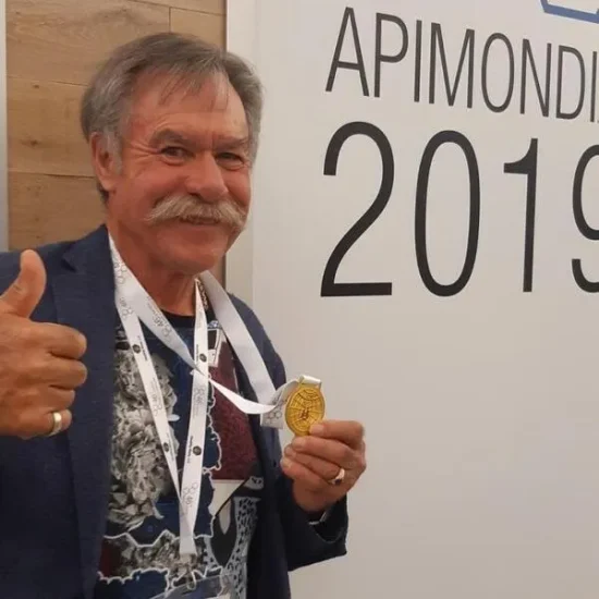 Tim Wendell poses with his gold medal at Apimondia 2019